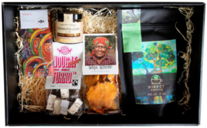 Gift box with products from direct trade: coffee, chocolate, mangoes, nuts and spices